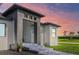 Striking modern home exterior showcasing a stone-accented entrance, clean lines, and manicured landscaping at 8045 Bosco Rd, Port Charlotte, FL 33981