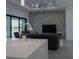 Open concept living room and kitchen featuring a large island, modern cabinetry, and stylish furniture at 8045 Bosco Rd, Port Charlotte, FL 33981