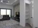 Bright living room features modern decor, stylish furnishings, and an open closet space at 8045 Bosco Rd, Port Charlotte, FL 33981