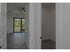 Light and bright living room with wood floors and views of the backyard at 8045 Bosco Rd, Port Charlotte, FL 33981