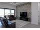 Bright living room features modern decor, stylish furnishings, and an accent wall at 8045 Bosco Rd, Port Charlotte, FL 33981
