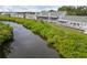 Waterfront view with lush foliage from the back patios of these beautiful villas at 805 Waterside Ln, Bradenton, FL 34209