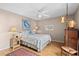 Calm bedroom with ceiling fan, neutral walls, and laminate flooring at 805 Waterside Ln, Bradenton, FL 34209
