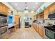 Spacious community kitchen with modern appliances, ample counter space, and a convenient serving window at 805 Waterside Ln, Bradenton, FL 34209