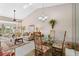 Bright and airy living room with vaulted ceilings, tile floors, and outdoor views at 805 Waterside Ln, Bradenton, FL 34209