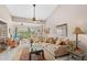 Comfortable living room with cozy seating, a ceiling fan, and an outdoor view at 805 Waterside Ln, Bradenton, FL 34209