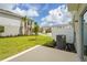 Well-maintained backyard with lush lawn and concrete patio for outdoor enjoyment and relaxing at 8705 Winter Breeze Way, Sarasota, FL 34241
