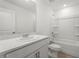 Bathroom featuring a single sink, neutral walls, and a shower-tub combo at 8705 Winter Breeze Way, Sarasota, FL 34241
