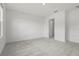 Neutral carpeted bedroom with a window, offering a calm and inviting space at 8705 Winter Breeze Way, Sarasota, FL 34241