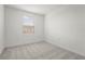 Comfortable bedroom with neutral carpeting and a window at 8705 Winter Breeze Way, Sarasota, FL 34241