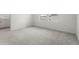 Spacious bedroom features neutral walls, plush carpet flooring, and a window at 8705 Winter Breeze Way, Sarasota, FL 34241