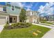 Charming townhome boasts colorful siding, well-manicured landscaping, and a welcoming facade at 8705 Winter Breeze Way, Sarasota, FL 34241