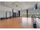 Spacious fitness room with mirrored wall, free weights, and an open layout for versatile workout routines at 8705 Winter Breeze Way, Sarasota, FL 34241