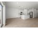 Open-concept living space featuring modern finishes and ample natural light with a sliding glass door at 8705 Winter Breeze Way, Sarasota, FL 34241