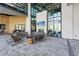 Inviting lounge area with stylish seating, fireplace, and floor-to-ceiling windows, offering a luxurious retreat at 8705 Winter Breeze Way, Sarasota, FL 34241