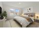 Cozy bedroom featuring neutral walls, carpet flooring, and a window for natural light at 8705 Winter Breeze Way, Sarasota, FL 34241
