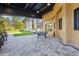 Outdoor patio featuring a ping pong table and a view of the manicured lawn, ideal for recreation at 8705 Winter Breeze Way, Sarasota, FL 34241