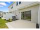 Private patio area with sliding glass doors, perfect for outdoor seating and relaxation at 8705 Winter Breeze Way, Sarasota, FL 34241