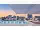 Rooftop pool with lounge chairs and city views, offering a luxurious and relaxing experience at 1305 4Th St # 301G, Sarasota, FL 34236