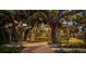 Picturesque walking path lined with mature trees and ambient lighting for a peaceful stroll at 1305 4Th St # 301G, Sarasota, FL 34236
