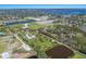 Expansive aerial view showcasing an attractive community with bodies of water and greenery at 1408 99Th Nw St, Bradenton, FL 34209