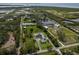 Stunning aerial view of a sprawling property surrounded by lush greenery and picturesque ponds at 1408 99Th Nw St, Bradenton, FL 34209