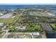 Expansive aerial view showcasing an attractive community with bodies of water and greenery at 1408 99Th Nw St, Bradenton, FL 34209