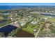 Expansive aerial view showcasing an attractive community with bodies of water and various houses at 1408 99Th Nw St, Bradenton, FL 34209