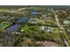 Panoramic aerial view capturing a serene property with multiple ponds and natural landscaping at 1408 99Th Nw St, Bradenton, FL 34209