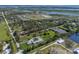Expansive aerial view showcasing an attractive community with bodies of water and greenery at 1408 99Th Nw St, Bradenton, FL 34209