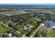 Gorgeous aerial view of the property surrounded by lush greenery, lakes, and coastal features at 1408 99Th Nw St, Bradenton, FL 34209