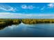 Aerial view of a waterway surrounded by lush greenery, featuring a bridge at 1408 99Th Nw St, Bradenton, FL 34209