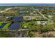 Captivating aerial view of a lush neighborhood featuring multiple ponds, greenery, and scattered residences at 1408 99Th Nw St, Bradenton, FL 34209