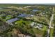 Expansive property featuring lush grounds, serene ponds, and multiple structures seen from an aerial perspective at 1408 99Th Nw St, Bradenton, FL 34209