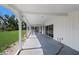 Covered back patio with backyard views, offering an ideal space for relaxation and entertaining at 1408 99Th Nw St, Bradenton, FL 34209