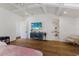 Hardwood floors and a vaulted ceiling accentuate the style of the main bedroom at 1408 99Th Nw St, Bradenton, FL 34209