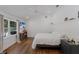 Bright bedroom with a TV, natural light and hardwood floors at 1408 99Th Nw St, Bradenton, FL 34209