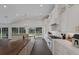 Bright, airy kitchen featuring custom white cabinets, a central island with wood countertop, and stainless-steel appliances at 1408 99Th Nw St, Bradenton, FL 34209