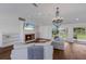 Cozy living room features a fireplace, TV, and access to the backyard at 1408 99Th Nw St, Bradenton, FL 34209