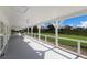 Inviting covered porch with ample space for seating, perfect for enjoying outdoor views at 1408 99Th Nw St, Bradenton, FL 34209