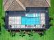 Aerial view of the pool with spa and a gas fire feature in screened lanai at 16917 Clearlake Ave, Lakewood Ranch, FL 34202