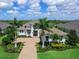 Aerial view of a beautiful single-Gathering home with well-manicured landscaping and a paver driveway at 16917 Clearlake Ave, Lakewood Ranch, FL 34202