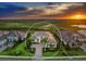 Areal view showing the elegant two-story home featuring a beautiful stone driveway, manicured landscaping at 16917 Clearlake Ave, Lakewood Ranch, FL 34202