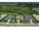 An aerial shot displays a lovely home with manicured landscaping in a well-maintained community at 16917 Clearlake Ave, Lakewood Ranch, FL 34202