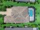Aerial view of home showing roof and screened lanai with pool at 16917 Clearlake Ave, Lakewood Ranch, FL 34202