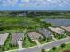 Aerial view features a home with lush landscaping and close proximity to a nature preserve at 16917 Clearlake Ave, Lakewood Ranch, FL 34202