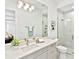 Sleek bathroom featuring a glass-enclosed shower, modern vanity, and contemporary lighting at 16917 Clearlake Ave, Lakewood Ranch, FL 34202