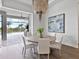 Dining room featuring a round table with seating for four and large windows with outdoor views at 16917 Clearlake Ave, Lakewood Ranch, FL 34202