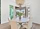 Dining area with large windows overlooking the screened-in pool area at 16917 Clearlake Ave, Lakewood Ranch, FL 34202