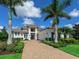 Beautiful two-story home with manicured landscaping, long brick driveway and a three-car garage at 16917 Clearlake Ave, Lakewood Ranch, FL 34202